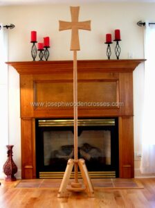 Greek Orthodox processional cross Oak Stand in front of fireplace