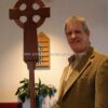 Irish Celtic Processional Cross in Mahogany with Stand closeup with joe